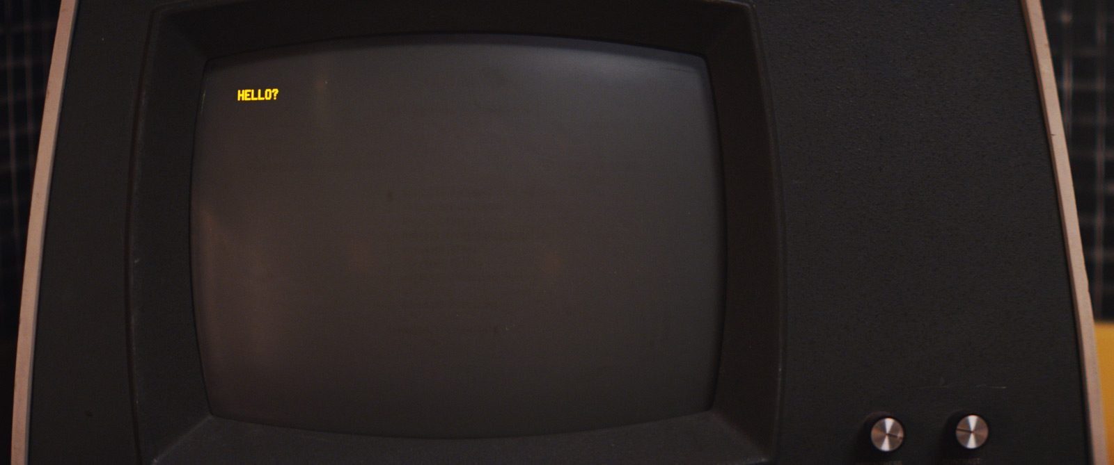 An old computer terminal with "Hello?" on the screen